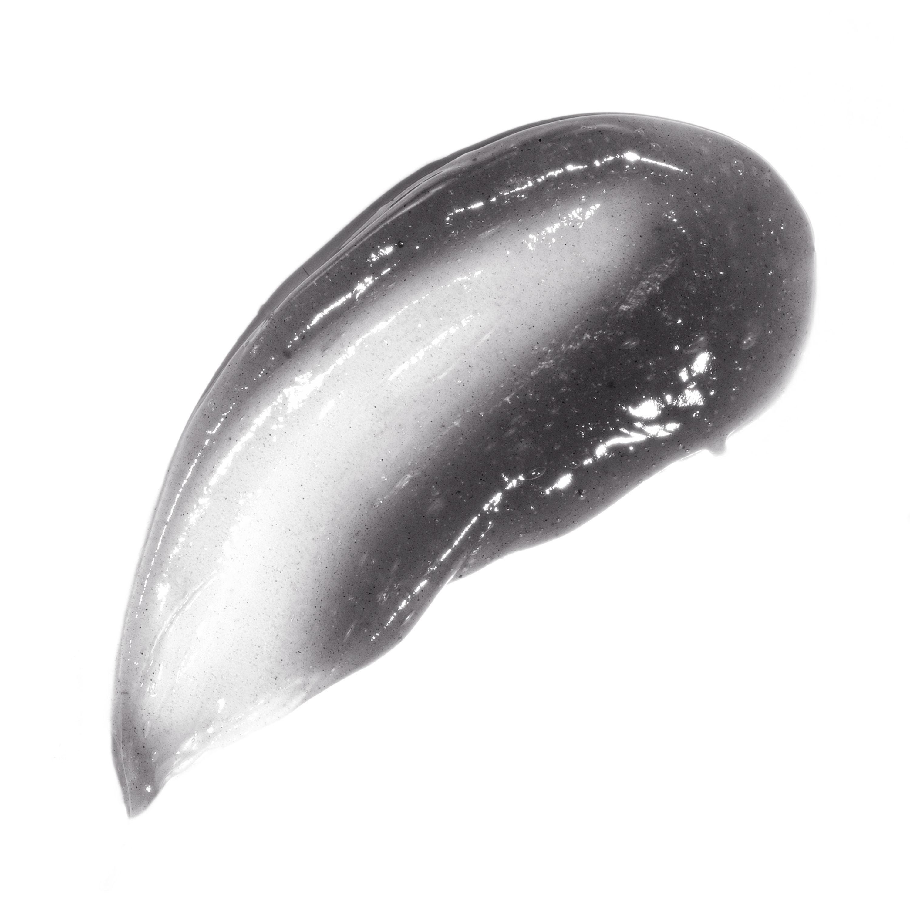 English: The Charcoal Acne Clearing Cleanser is a charcoal color liquid. Français: Le nettoyant anti-acné au charbon est un liquide de couleur charbon.