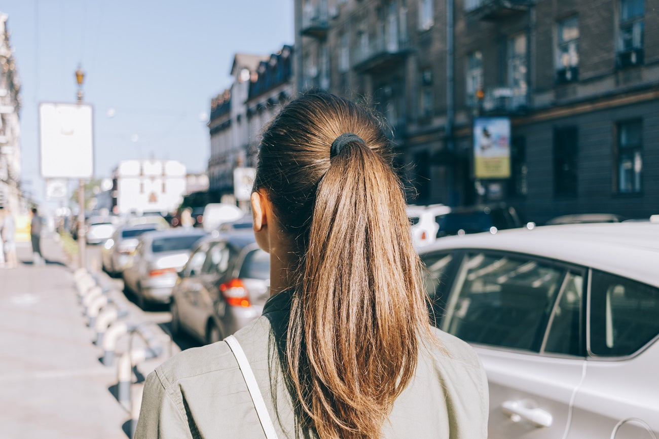 Woman with a straight, frizz-free ponytail