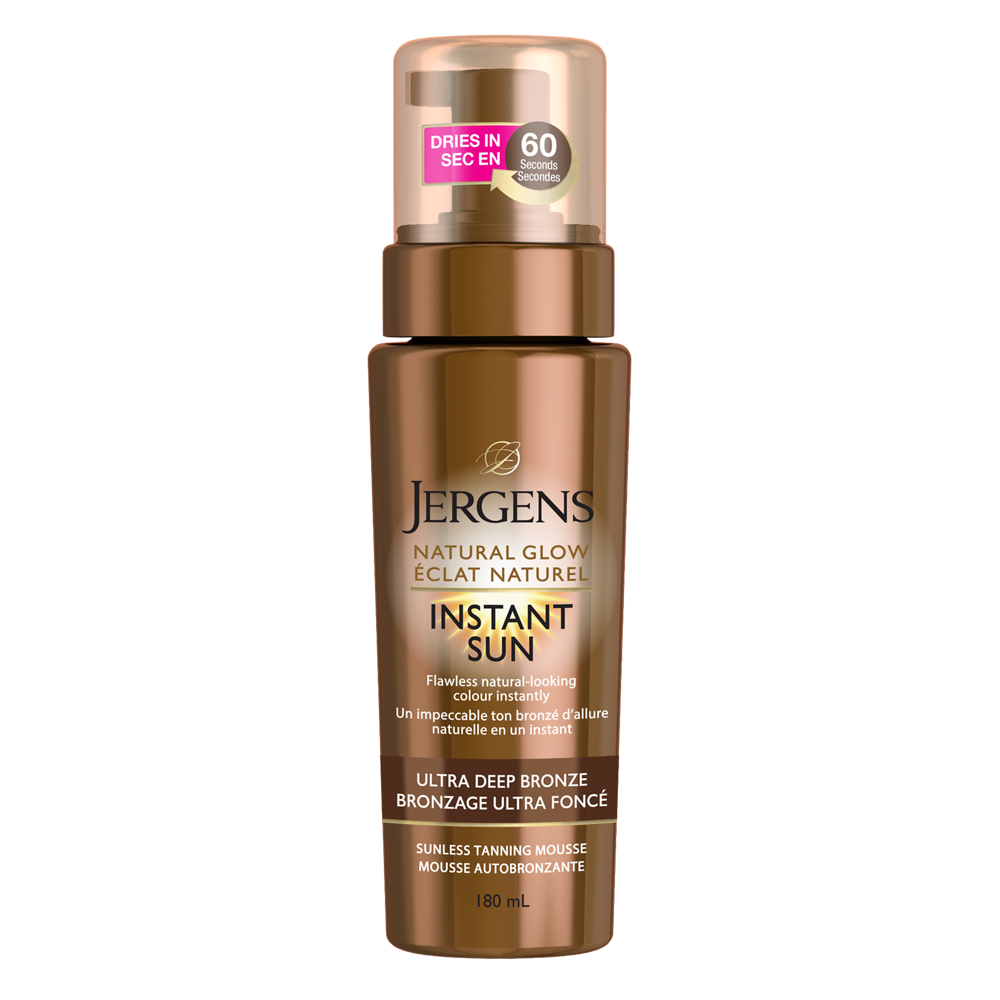 English: Natural Glow Instant Sun Mousse product image. It comes in a brown pump bottle. Français: Image du produit Mousse Éclat Naturel Instant Sun. Offert dans une bouteille brune à pompe.